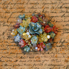 This pretty flower brooch is a unique item that would liven up any outfi... click for more information